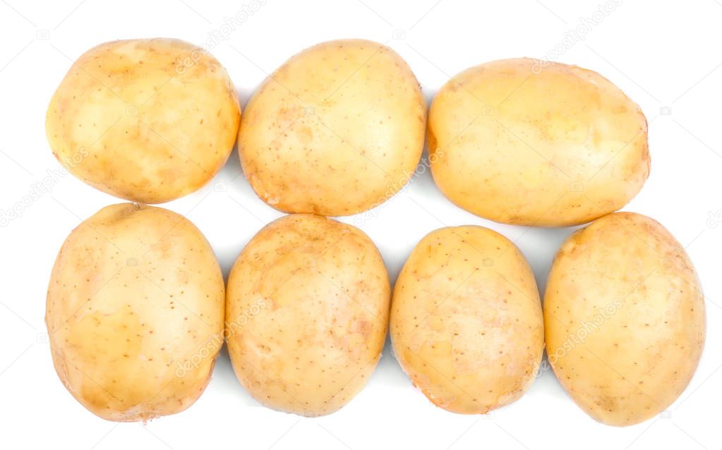 Top view of a lot of fresh and organic potatoes, isolated on a white background. New potatoes, close-up. Fresh vegetables. 