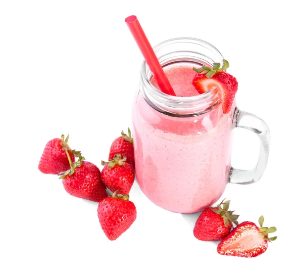 A mason jar full of organic shake. A bubbled pink milkshake isolated on a white background. A sweet smoothie and raw strawberries. — Stock Photo, Image