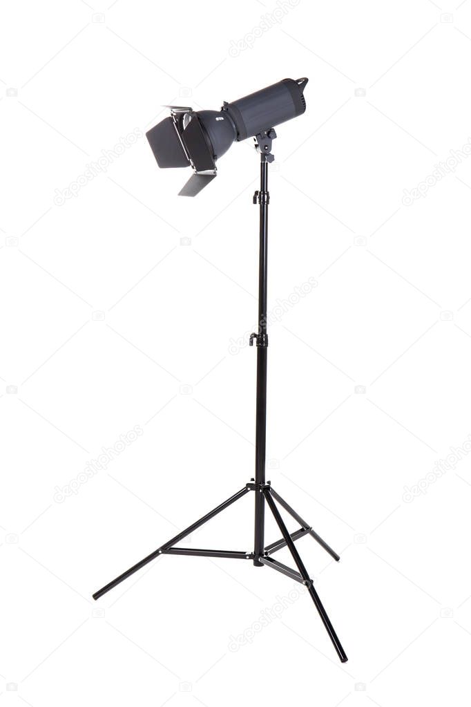 Studio lighting on a tripod stand, isolated on a white background. Professional lighting. Studio spotlight. Photo equipment.