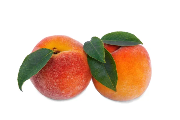 Close-up of sweet bright peaches, isolated on a white background. Two ripe, nutritious, beautiful fruits. A healthful breakfast. — Stock Photo, Image