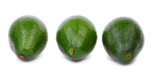 Close-up of organic avocado isolated on white background. Healthy food. Tropical fruits. Three fresh and whole avocados. — Stock Photo, Image