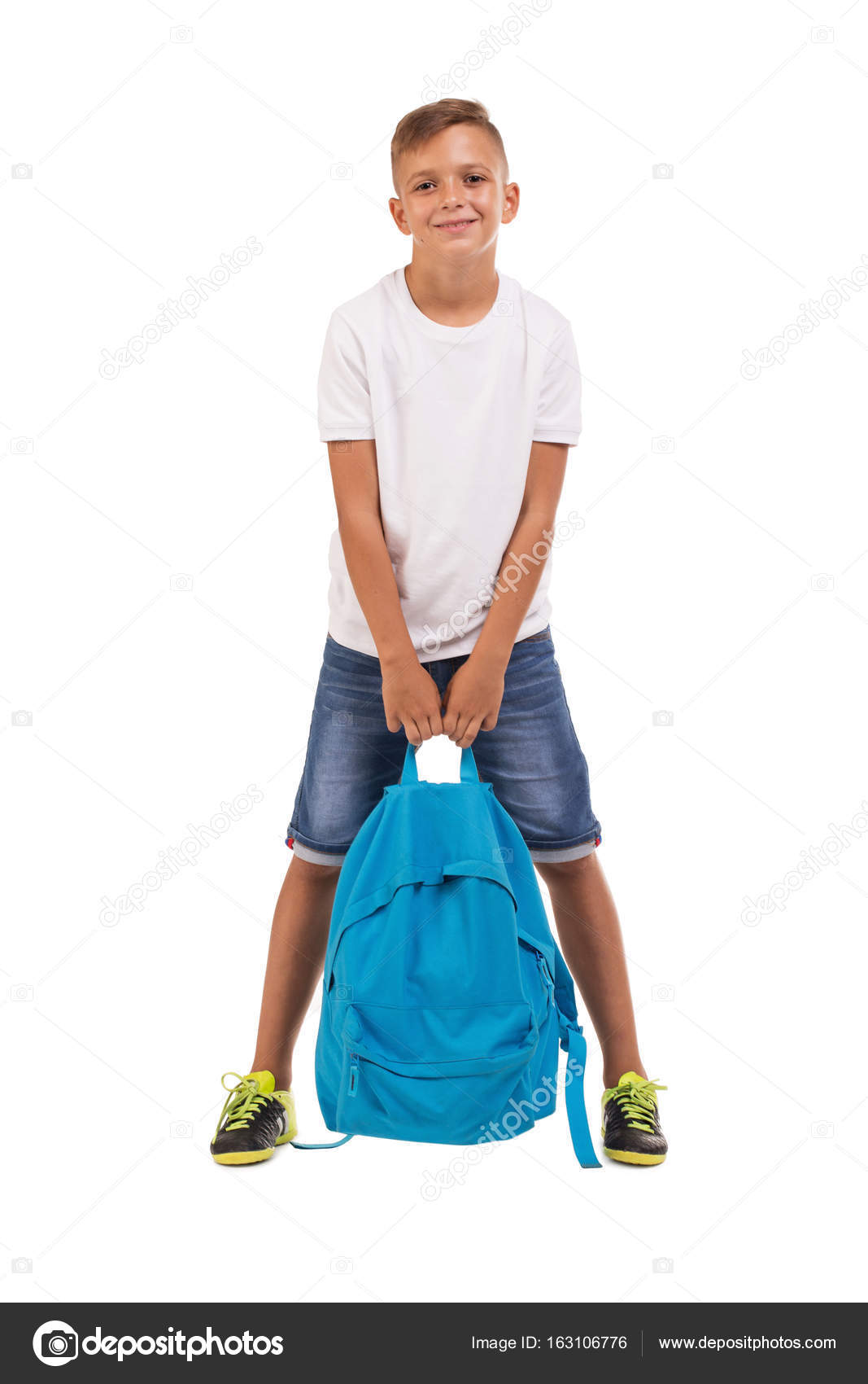 kid holding backpack