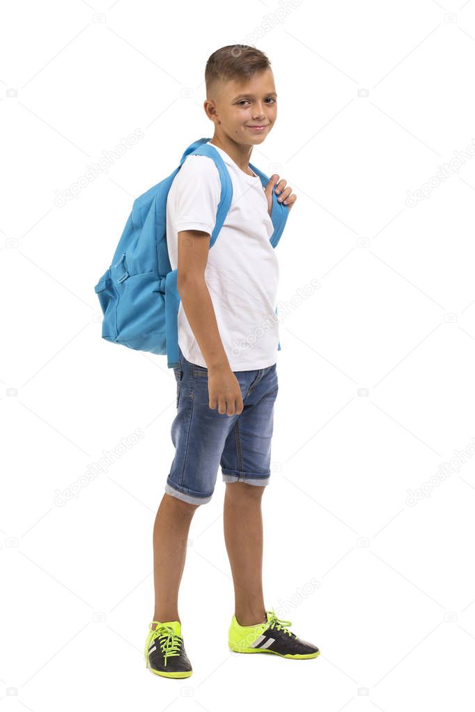 A full-length portrait of a pupil with backpack isolated on a white background. School boy. Back to school concept.