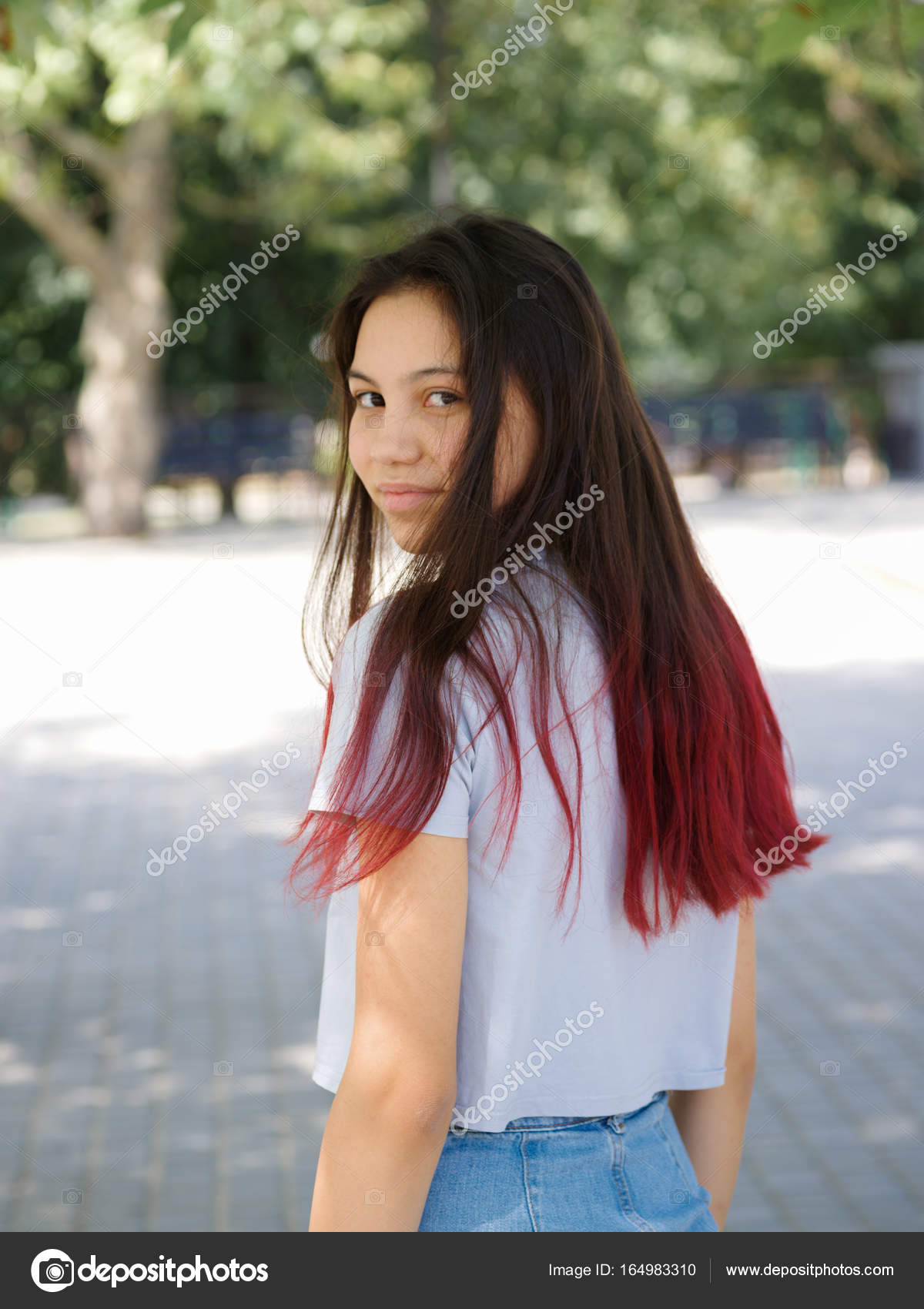A Fashion Charming Hipster Girl In Casual Clothes Posing On A