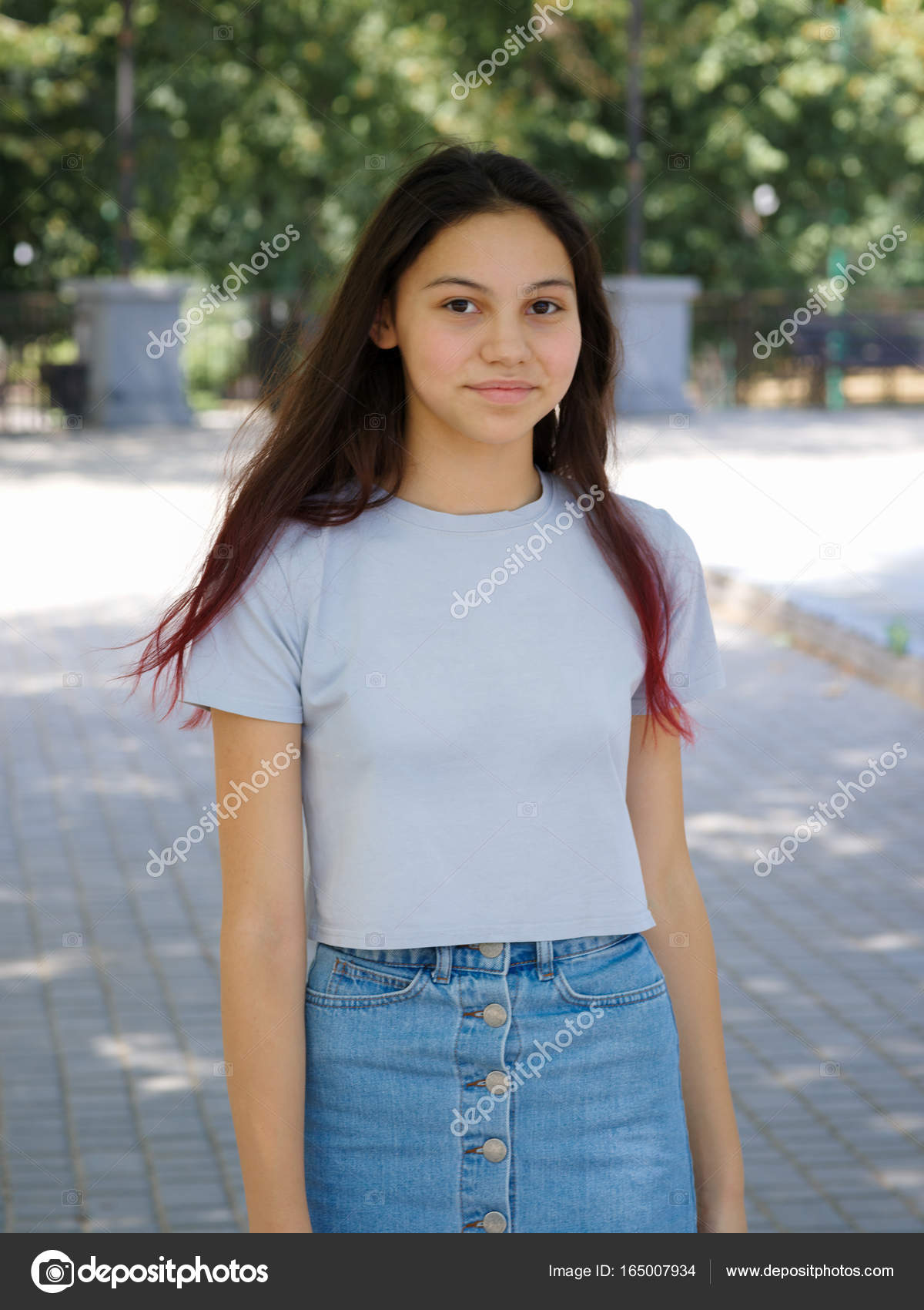 A Fashion Charming Hipster Girl In Casual Clothes Posing On A