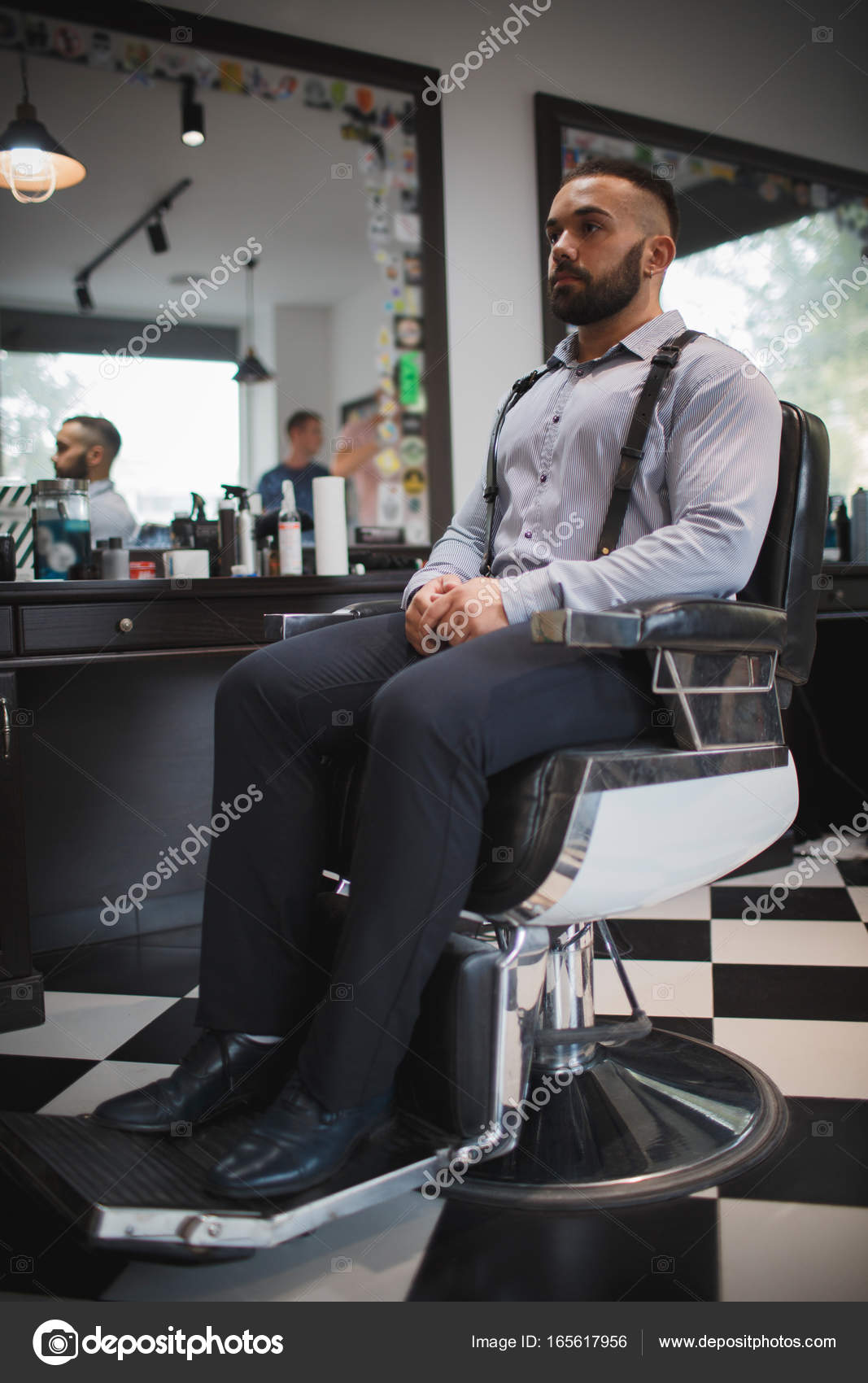 A Portrait Of A Stylish Man On Barbershop Background
