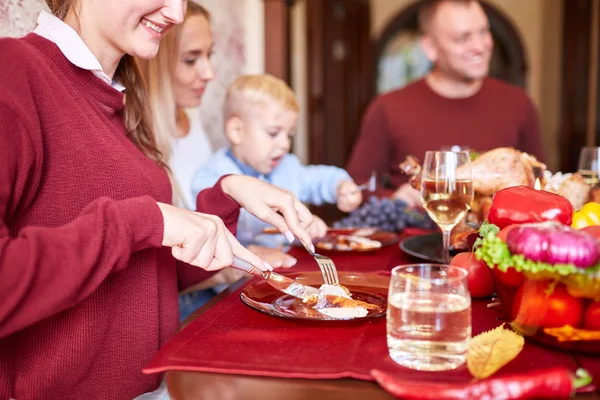 Happy family dining on Christmas on a blurred festive background. Celebrating Thanksgiving concept. Happy new year. — Stock Photo, Image