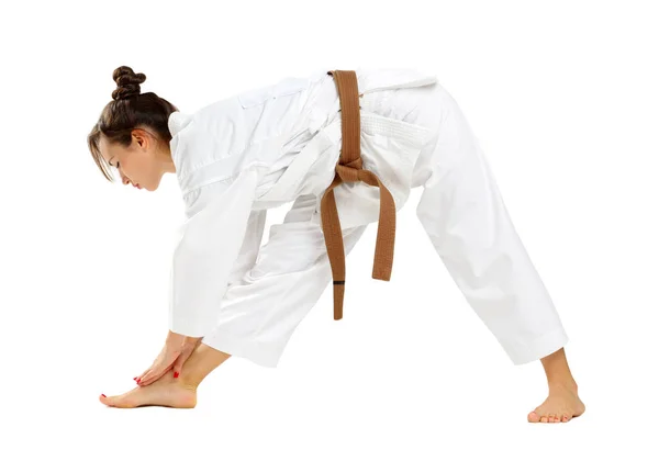 Girl in karate uniform on isolated white background — Stock Photo, Image