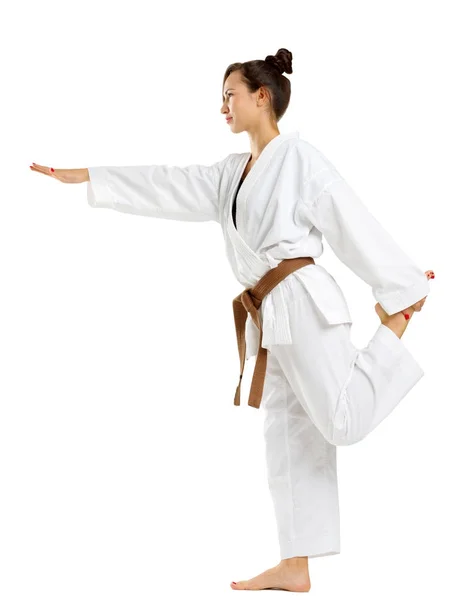 Chica en uniforme de karate sobre fondo blanco aislado — Foto de Stock