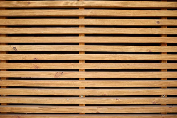 Light brown vintage horizontal wood planks background in a black lines.