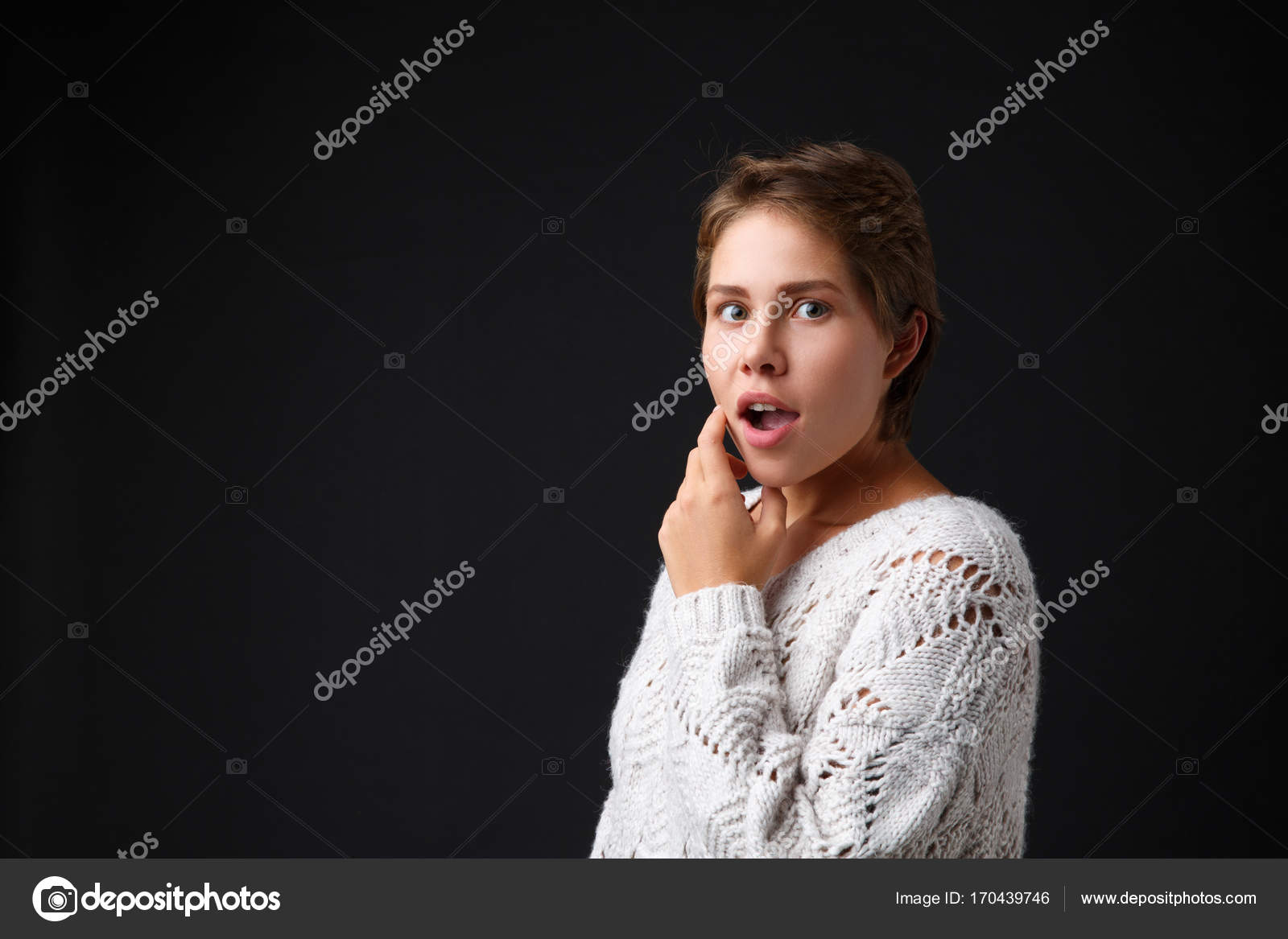 Dark Haired Girl With Short Hair On A Black Background Stock