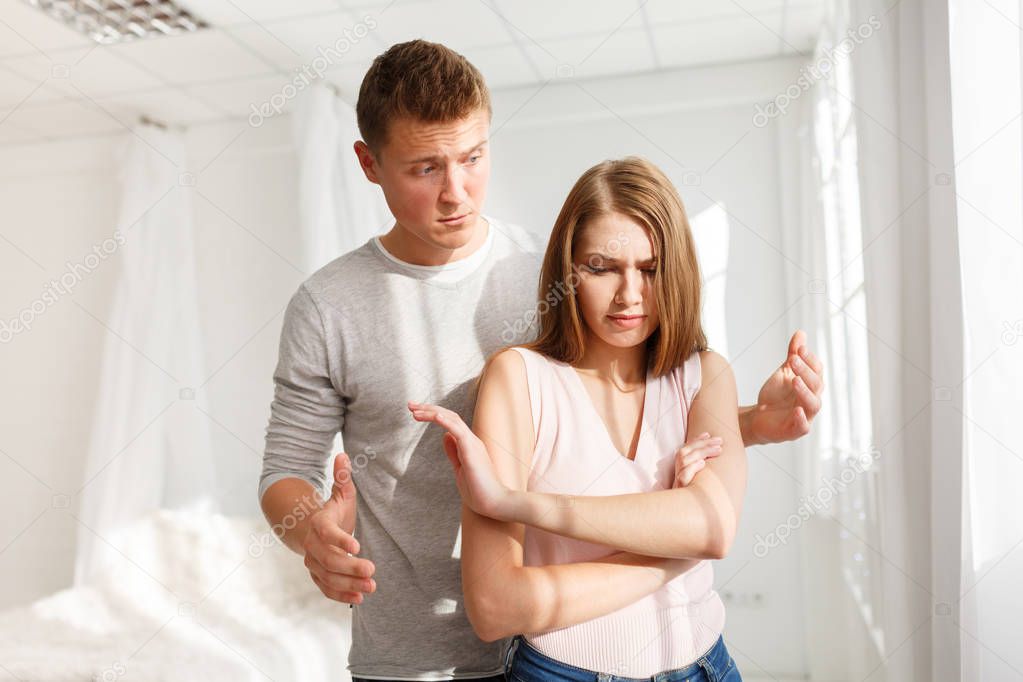 The quarrel of a guy and a girl. A young couple swears. The concept of quarrels in families.