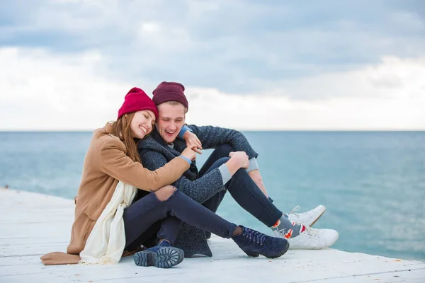 Cheerful young couple having fun and laughing together outdoors. — Stock Photo, Image