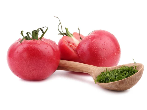 Tomates vermelhos frescos com uma colher de madeira — Fotografia de Stock