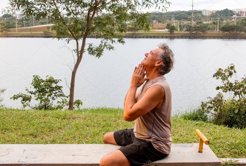 Senior Man Stretching his Neck After Working Out 