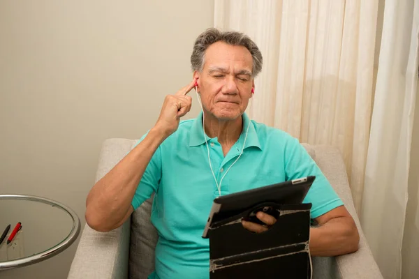 Senior Man Seated Listening News His Smart Table — Stock Photo, Image