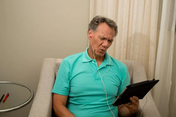 Senior Man Seated Listening News His Smart Table — Stock Photo, Image