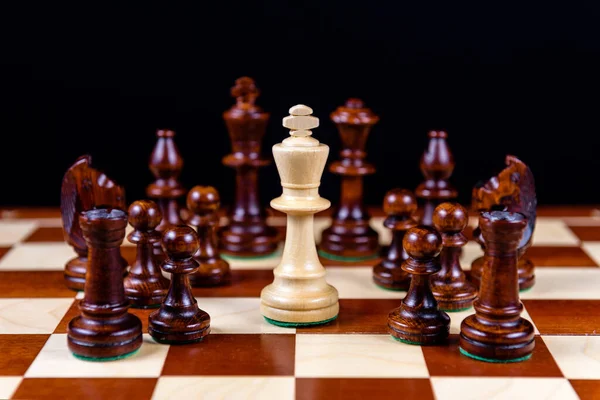 White King Surrounded Black Figures — Stock Photo, Image