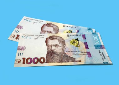 Ukrayna Hryvnia 'sı, arka planda 1000 Hryvnia' lık iki banknot. Ukraynalı bankacıların mali geçmişi. Para arkaplanı.