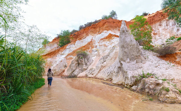 Tourists visit spring in ecotourism on spring day