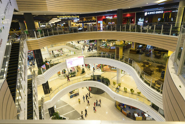 Ho Chi Minh City, Vietnam - January 8th, 2017: Shopping Mall with modern architecture several floors equipped with escalators many amusement parks, restaurants, movie theaters attract visitors weekend