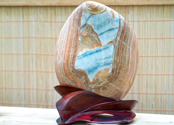 Ho Chi Minh City, Vietnam - February 11, 2018: Many mineral stone placed in wooden soles on display in exhibitions bonsai on Lunar New Year's day in the park in Ho Chi Minh City, Vietnam.