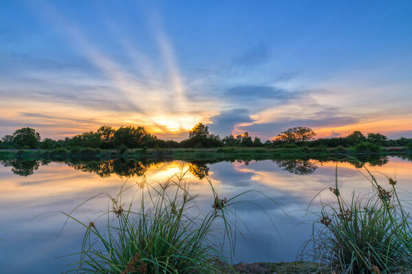 Sunset along the river as the sun down horizon Sunstar really dramatic end of a sunny day.