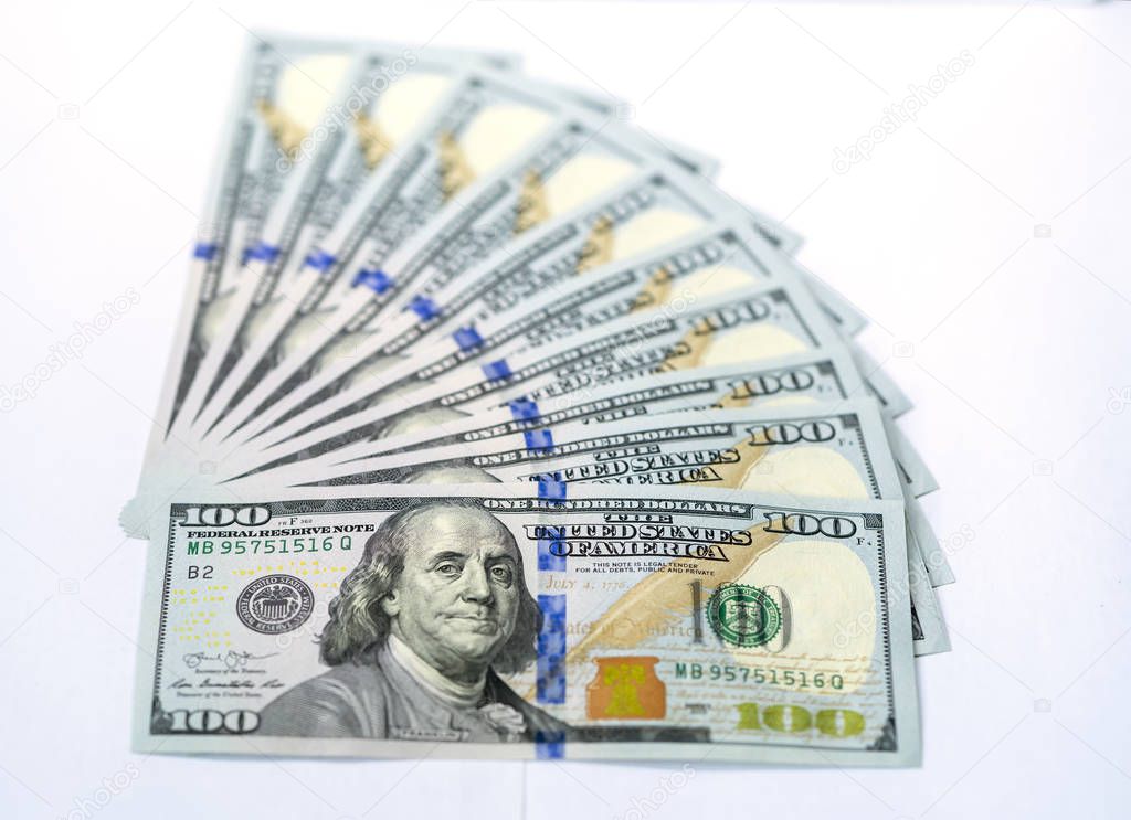 USD 100 dollars banknotes on a group of money isolated on white background. Business and finance concept.