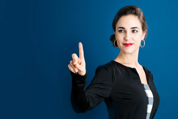 Woman pointing to something — Stock Photo, Image