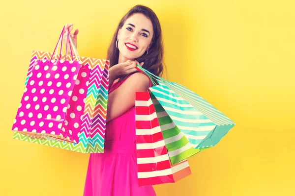 Woman holding shopping bags — Stock Photo, Image