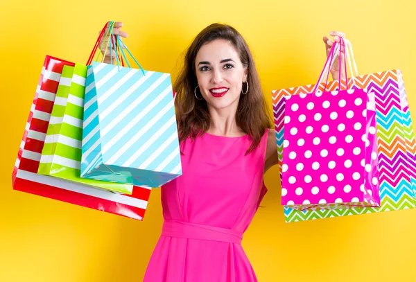 Mujer sosteniendo bolsas de compras — Foto de Stock