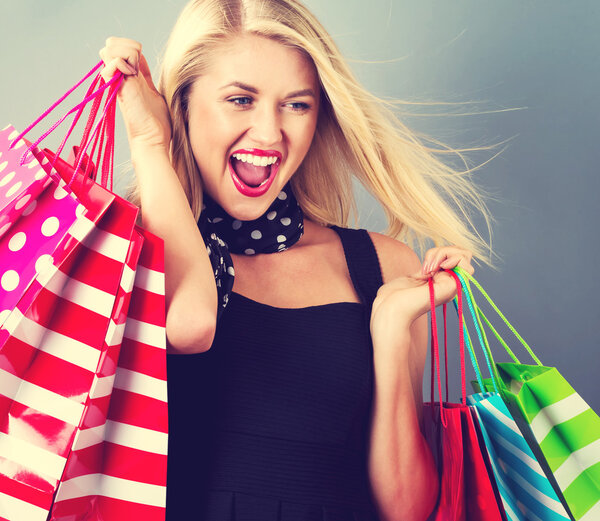 young woman holding shopping bags