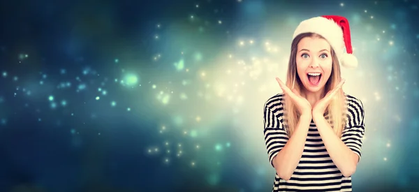 Young woman posing in Santa hat — Stock Photo, Image