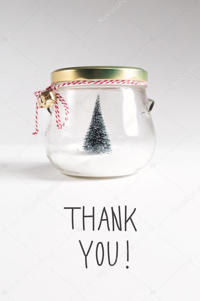 postcard with Christmas tree in jar and inscription