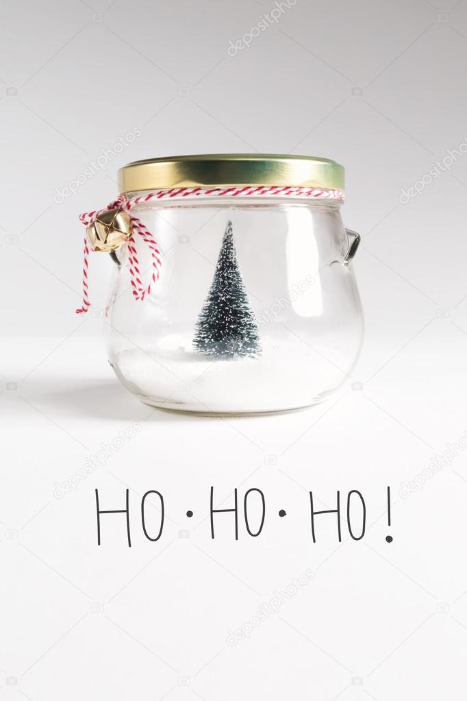 postcard with Christmas tree in jar and inscription