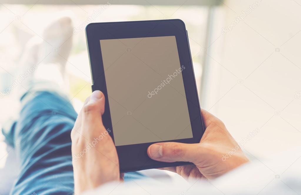 man reading e-book