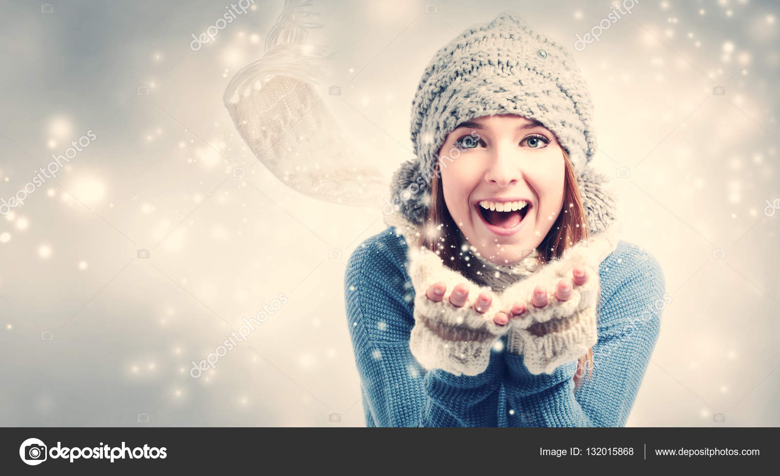 Happy young woman blowing snow — Stock Photo © Melpomene 132015868