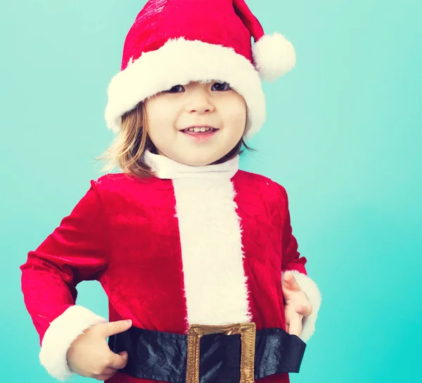 Glückliches Kleinkind-Mädchen im Weihnachtsmann-Kostüm — Stockfoto