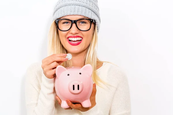 Mujer joven con una alcancía — Foto de Stock