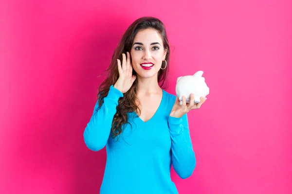 Jovem com um banco porquinho — Fotografia de Stock