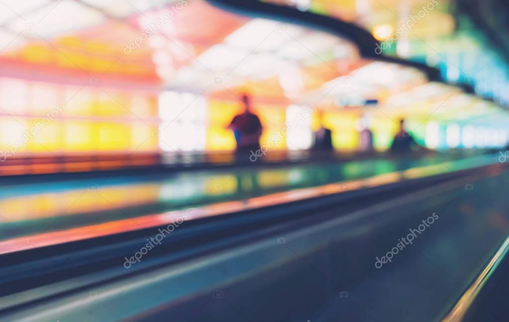Blurred airport interior with people