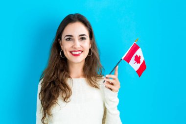 Young woman holding Canadian flag clipart