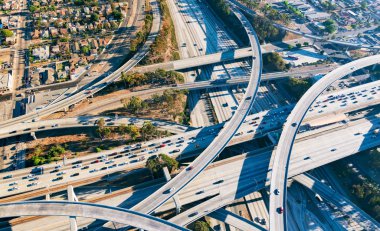 Aerial view of a freeway intersection in Los Angeles clipart