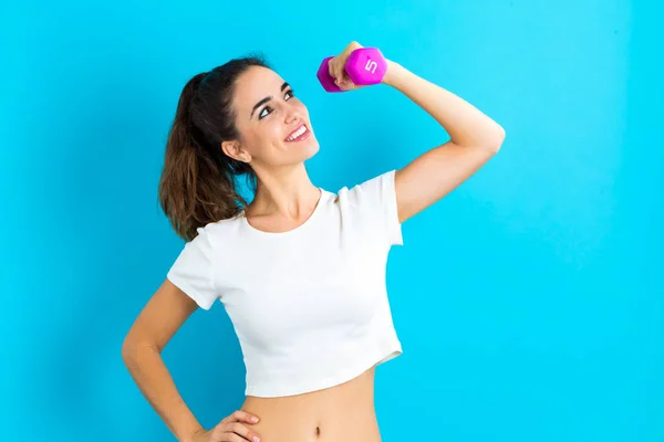 Woman working out with dumbbell — Stock Photo, Image