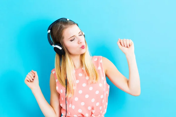 Happy young woman with headphones — Stock Photo, Image