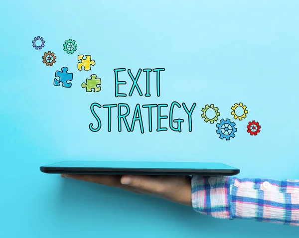 タブレットに exit 戦略コンセプト — ストック写真