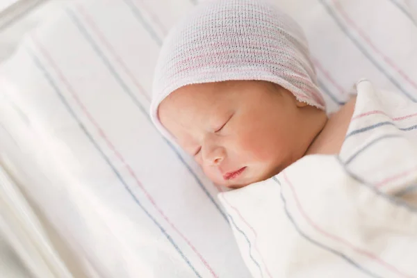 Newborn infant baby boy lying in a hospital bed — Stock Photo, Image