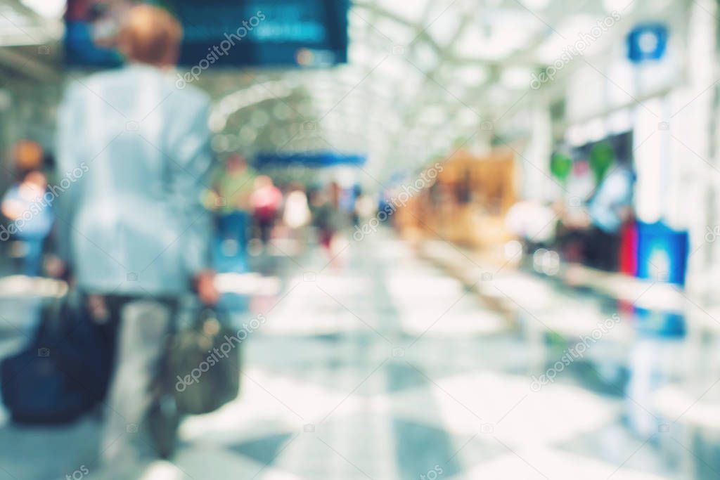 Blurred airport interior with people