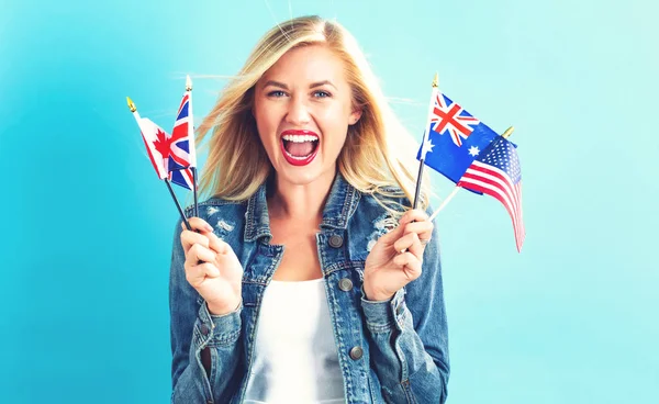 Woman with flags of English speaking countries