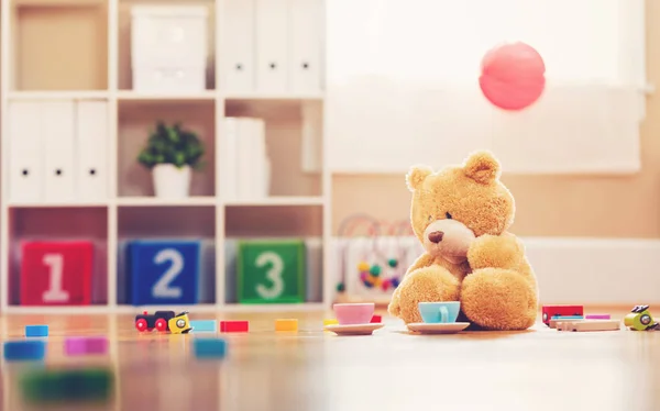 Teddy bear on floor — Stock Photo, Image